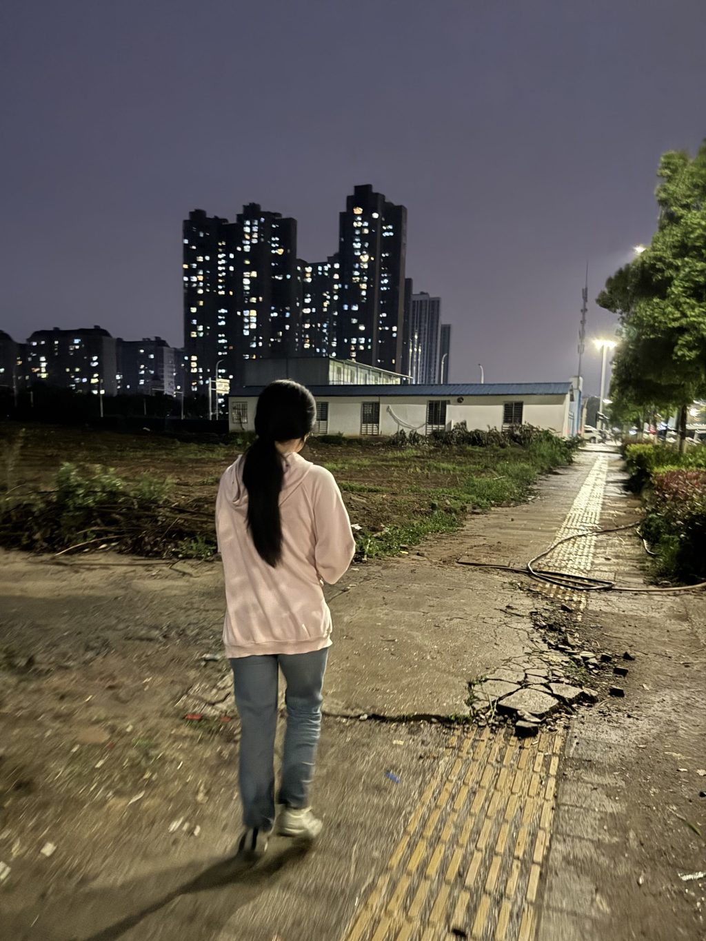 Girl walking at night in China