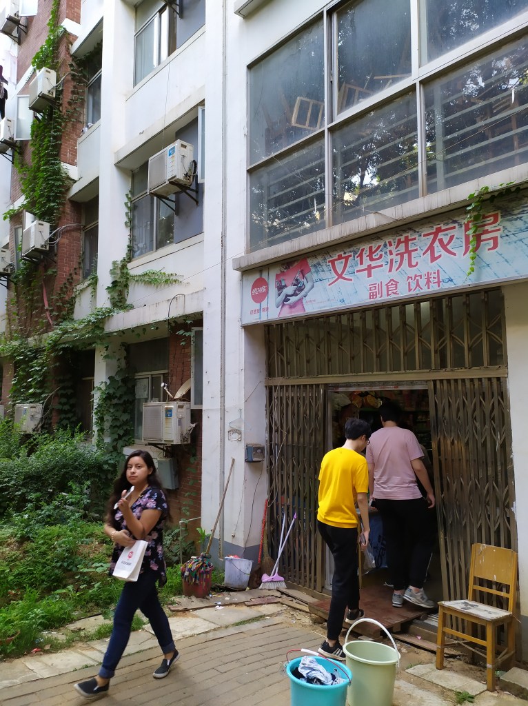 This image shows students walking into a dormitory shop in Wuhan, China in June of 2019.