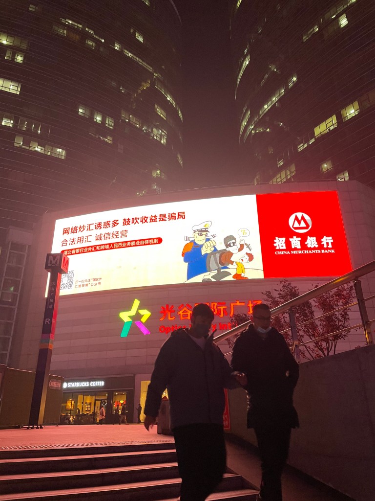This photo shows two men descending into a Wuhan underground walkway in 2020.