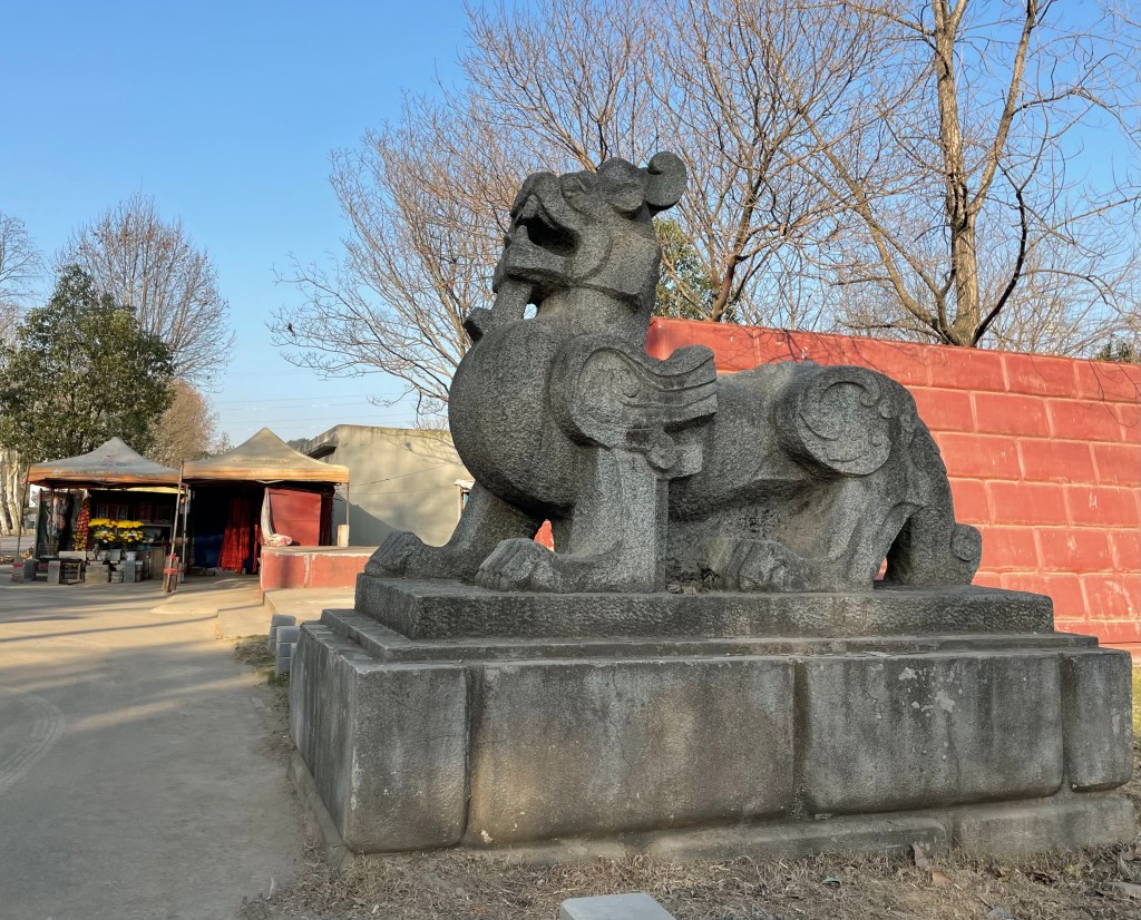 This is a photo of a pixiu in Wuhan, China. The statue is from New China and is not old. It represents a god of wealth. Taken in January, 2021.