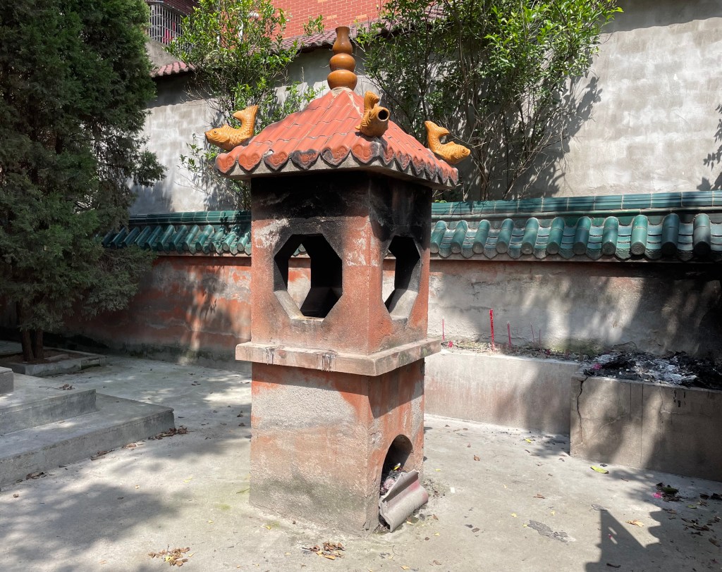 This photo shows a furnace in a Chinese temple meant to burn joss ghost money. It was taken in 2021.