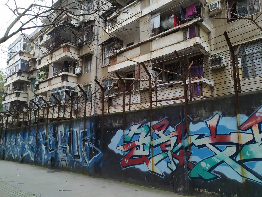 A photo of a wall mural in Wenhua College's campus in Wuhan, China. The photo is from the pandemic era. 